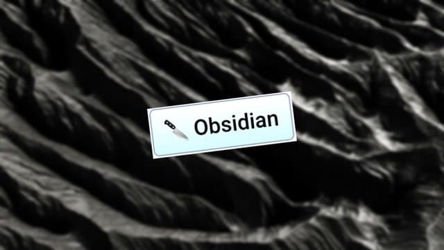Infinite Craft Obsidian block atop a blurred black, rocky background