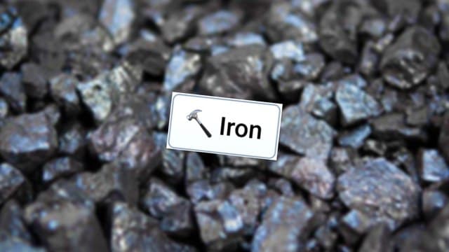 Infinite Craft Iron block atop a blurred background image of grey-silver metallic rocks